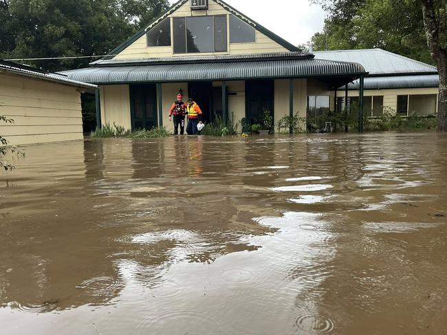Floodwaters are seen in and around Taree on the mid-north coast of NSW as torrential rain inundates the region, cutting off communities with NSW SES crews winching people to safety from rooftops and surging rivers. Picture: SES via NewsWire