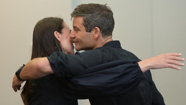 Prime Minister Jacinda Ardern embraces partner Clarke Gayford after she announces her resignation.