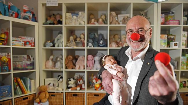 University of Adelaide pathology Professor Roger Byard with Arielle, 2 months, at the Infant Boutique in Norwood for Red Nose day. Picture: Tom Huntley