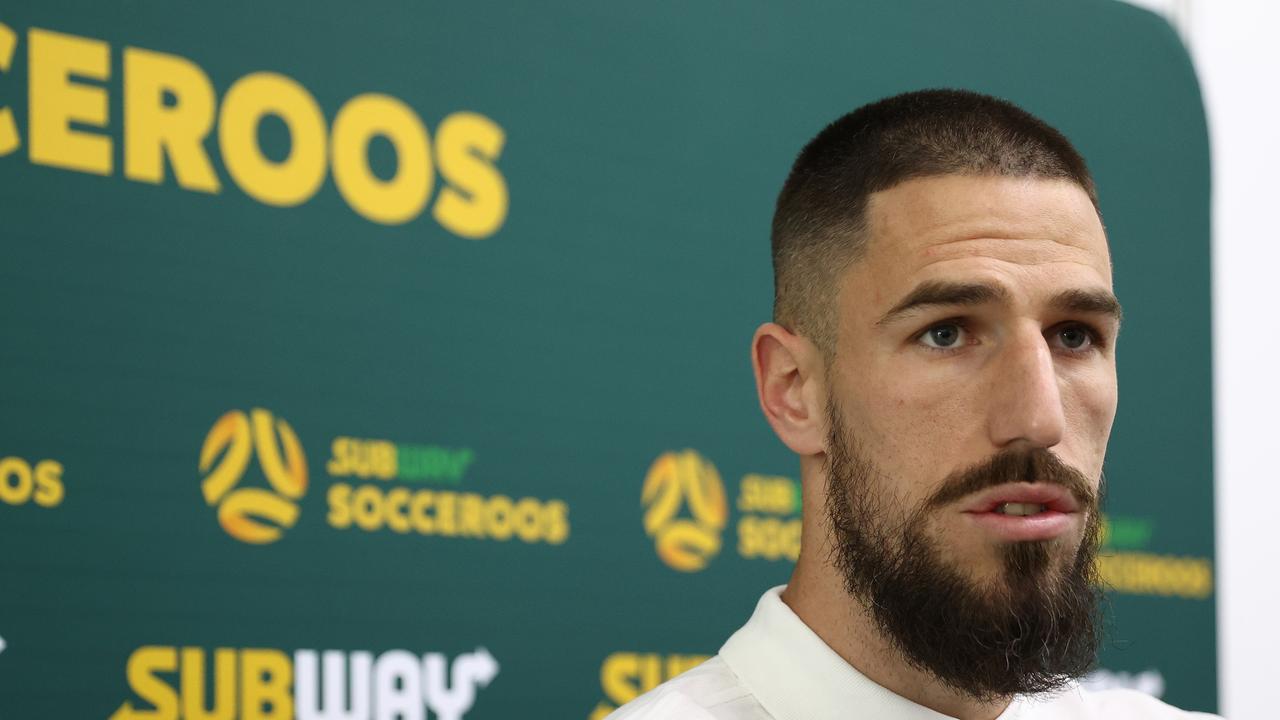 Milos Degenek of Australia speaks to the media at the Aspire Training Ground.