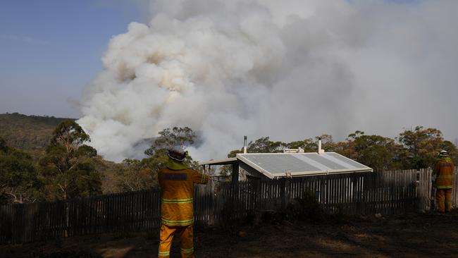 NSW Rural Fire Service crews monitoring fires at Penrose. The bushfires were the impetus of a breakdown of relations in council. Picture: AAP Image/Dan Himbrechts