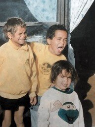 Eddie Betts’ cousin Richard Sambo, Eddie (middle} and youngest sister Lucy, taken at the back of Aunty Tessa’s house in Kalgoorlie, from his book The Boy from Boomerang Crescent. Picture: Supplied