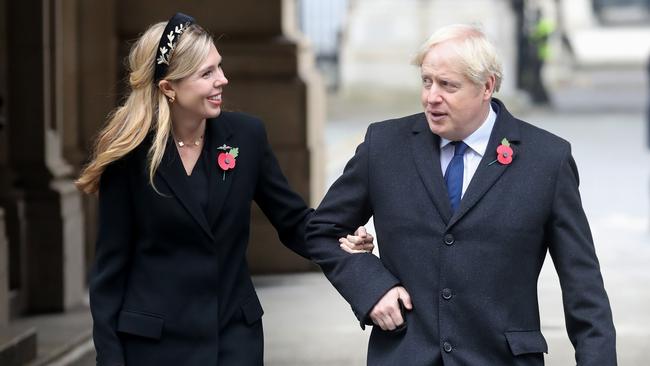 Britain's Prime Minister Boris Johnson and his parter Carrie Symonds meet veterans at the Remembrance Sunday ceremony at the Cenotaph on Whitehall in central London. Picture: Getty