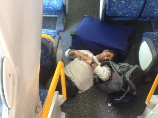 A passenger lays on train floor after impact. Picture: Brett Saunders