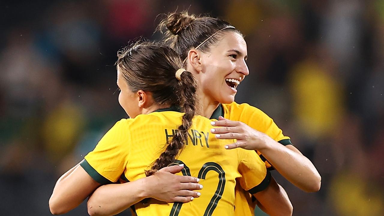 What a night for teenager Bryleeh Henry, here with teammate Steph Catley.