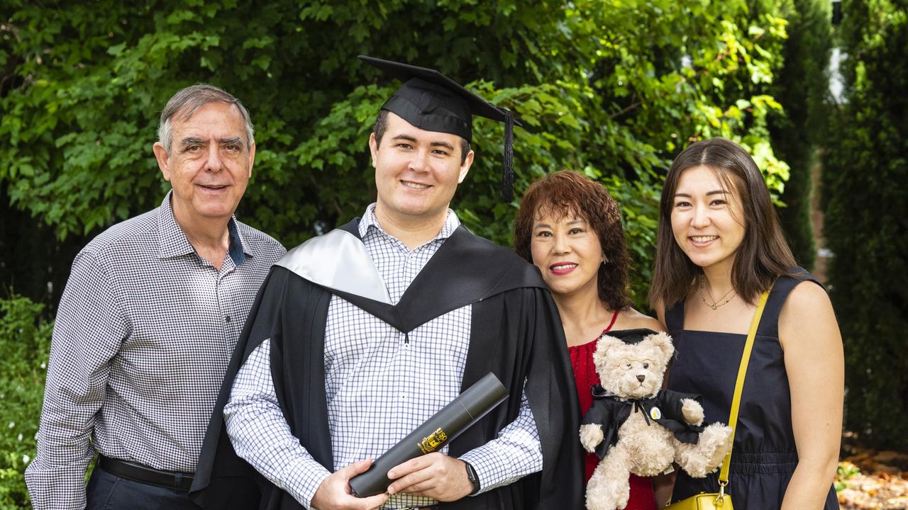 James Hearn (Bachelor of Business) is congratulated by Michael Fardouly, Lydia Hearn and Ellis Hearn (right) at the UniSQ graduation ceremony at Empire Theatres, Tuesday, December 13, 2022. Picture: Kevin Farmer