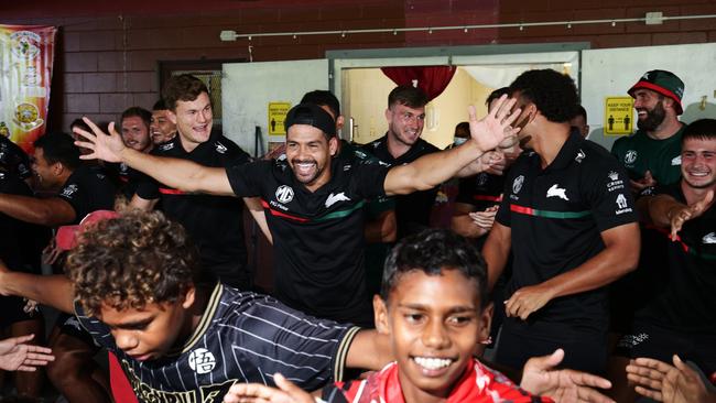 South Sydney Rabbitoh's Cody Walker leads his team in a traditional dance with Yarrabah children at Yarrabah's Jilara Oval. Picture: Brendan Radke