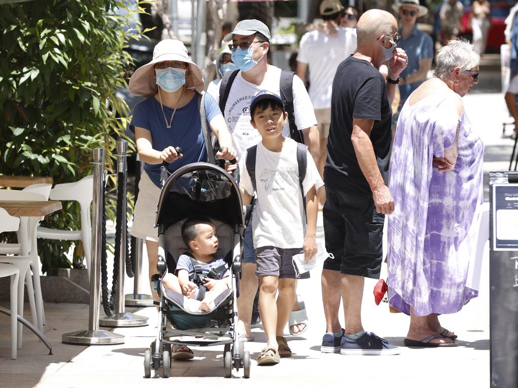 Tourists wearing masks while shopping on Hastings street in Noosa last year. Picture Lachie Millard