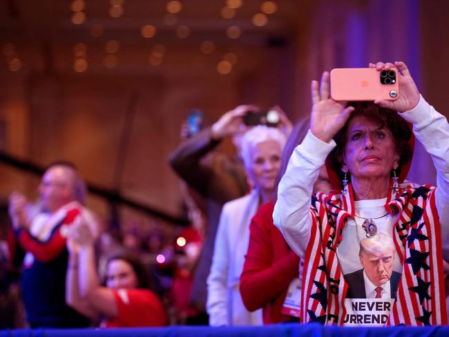 Trump devotees take photos at the annual four-day gathering that included conservative leaders from other countries. Picture: Andrew Harnik / Getty via AFP