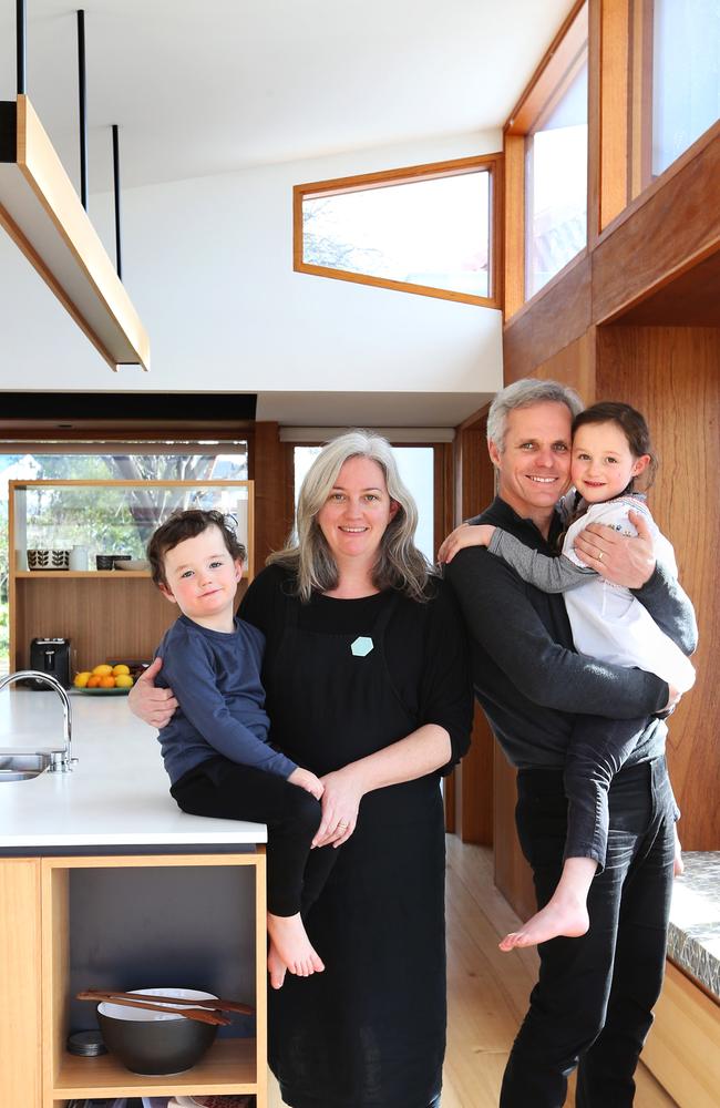 Miranda Hunt and Ian Lundy with their children Otto, 3, and Sofia, 5, in the kitchen of their transformed home. Picture: NIKKI DAVIS-JONES