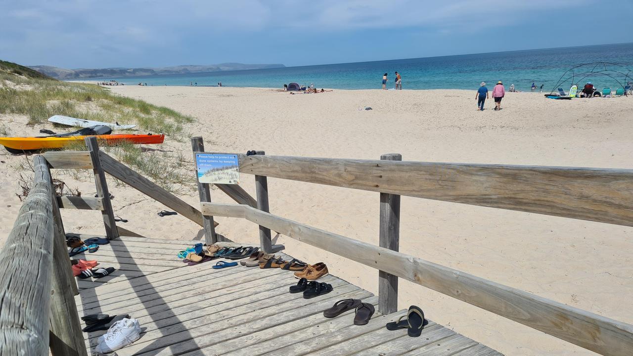 Beach pic proves quirky Aussie summer pact: Don't take the thongs!