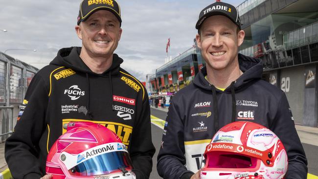 David Reynolds and Mark Winterbottom unveiled the limited-edition pink racing helmets which have been designed and painted by renowned helmet artist Trent Rogers. Picture: Supplied