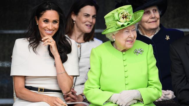 Queen Elizabeth sits with Meghan, Duchess of Sussex during her first engagement with the Queen in Chester.