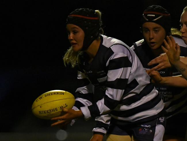 Scarlett Lynch of Macedon handballs during the 2023 Rookie Me RDFNL WomenÃs Grand Final match between Kyneton and Macedon at Gilbert Gordon Oval in Woodend, Victoria on August 5, 2023. (Photo by Josh Chadwick)