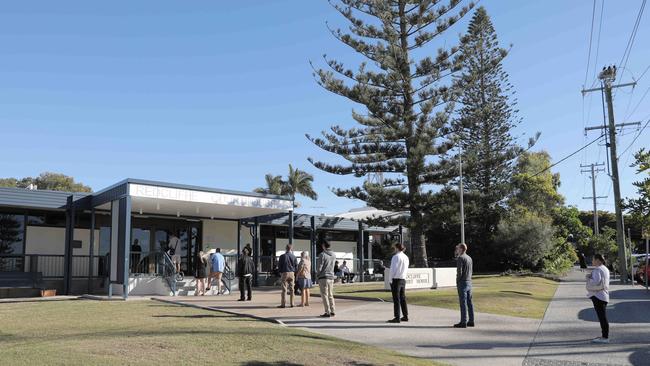 A long line of defendants line up outside Redcliffe Magistrates Court on July 20.