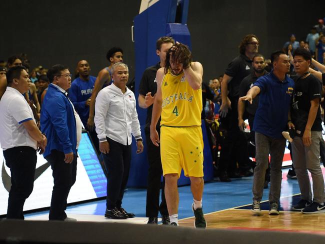 Goulding clutches his head after the attack. Picture: AFP