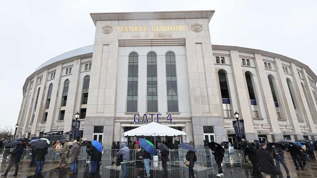 People wait in line to enter a coronavirus vaccination site at Yankee Stadium. Picture: AFP