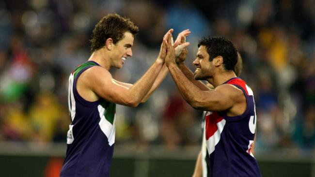 Marcus Drum and Jeff Farmer celebrate a win.