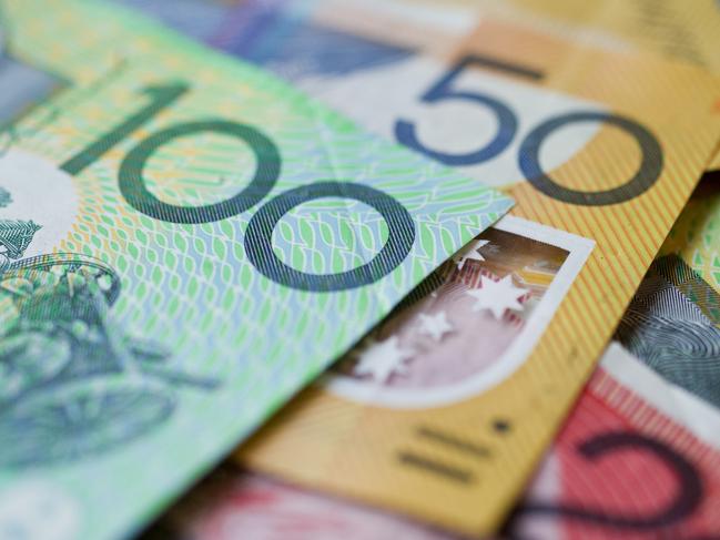 Australian money background showing $100, $50 and $20 notes with a shallow depth of field.