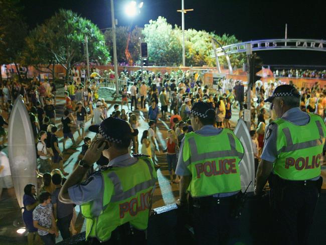 GOLD COAST, AUSTRALIA - NOVEMBER 23:  Police officers watch over the Schoolies week celebrations in Surfers Paradise on November 23, 2008 on the Gold Coast, Australia. Schoolies is the annual celebration by year 12 students following the culmination of their HSC exams. The celebrations happen in several official locations throughout Australia, but the Gold Coast kicks off the celebrations as the Queensland exams finish ahead of all other states.  (Photo by Sergio Dionisio/Getty Images)