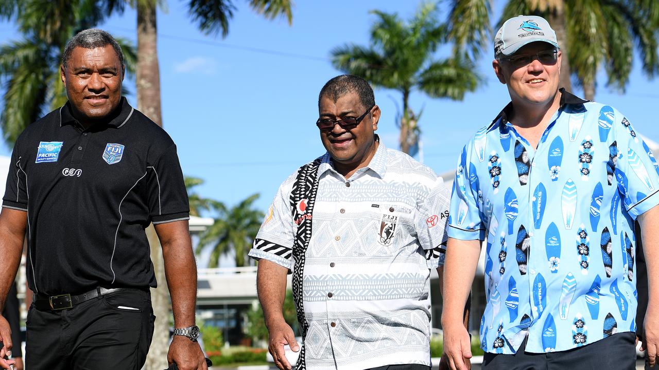 Australian Prime Minister Scott Morrison with former rugby league player Petero Civoniceva and Executive Chair of Fiji National Rugby League Peni Musunanasi. AAP Image/Dan Himbrechts
