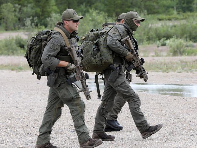 A tactical team continue their search for the two suspected killers. Picture: Clint Brewer/ News Corp Australia