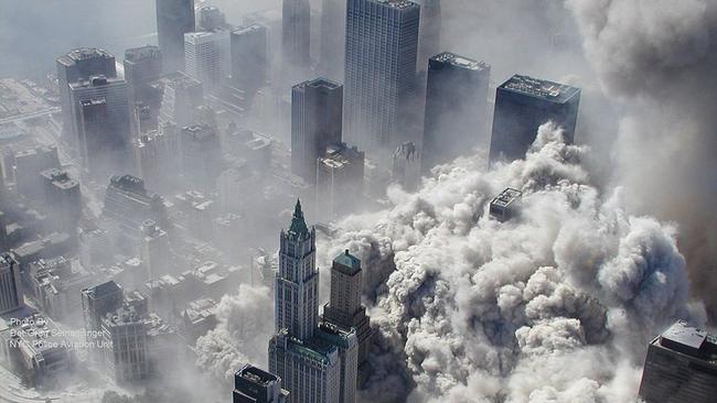 Clouds of choking dust and ash rise from the crushed remnants of the World Trade Centre; a businessman makes his way out of the rubble. Picture: ABC News