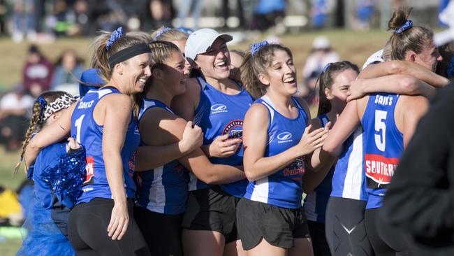 Saints players celebrate their win over Roosters in the 2019 Women’s A-grade touch grand final.