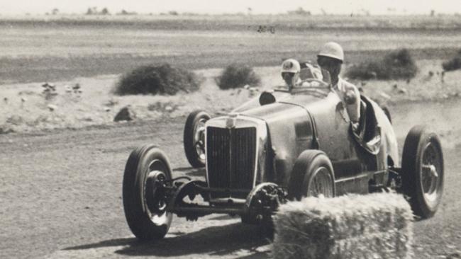 Cars racing at the Altona track.