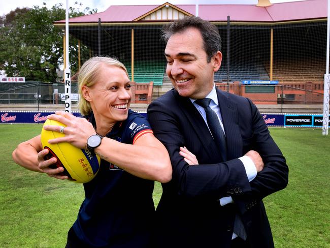 Premier Steven Marshall and Erin Phillips pose for a photo after the State Government announced its continued funding of the Adelaide Crows AFLW team at the Parade Oval Monday,December,3,2018.(Image AAP/Mark Brake)