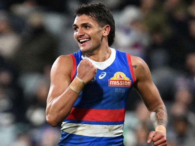 GEELONG, AUSTRALIA - JULY 20: Jamarra Ugle-Hagan of the Bulldogs celebrates kicking a goal during the round 19 AFL match between Geelong Cats and Western Bulldogs at GMHBA Stadium, on July 20, 2024, in Geelong, Australia. (Photo by Daniel Pockett/Getty Images)