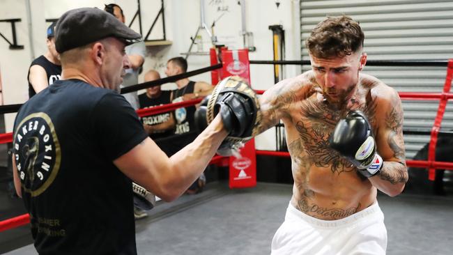 Jack Brubaker does some pad work on Tuesday ahead of his December fight against Tim Tszyu. Picture Rohan Kelly