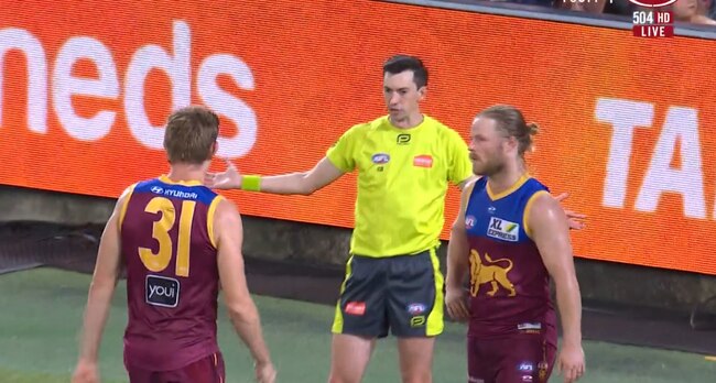 Brisbane's Harris Andrews was penalised for putting his arms out against Collingwood.