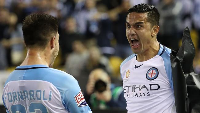 Tim Cahill and Bruno Fornaroli celebrate a goal against Melbourne Victory. Picture: Getty Images