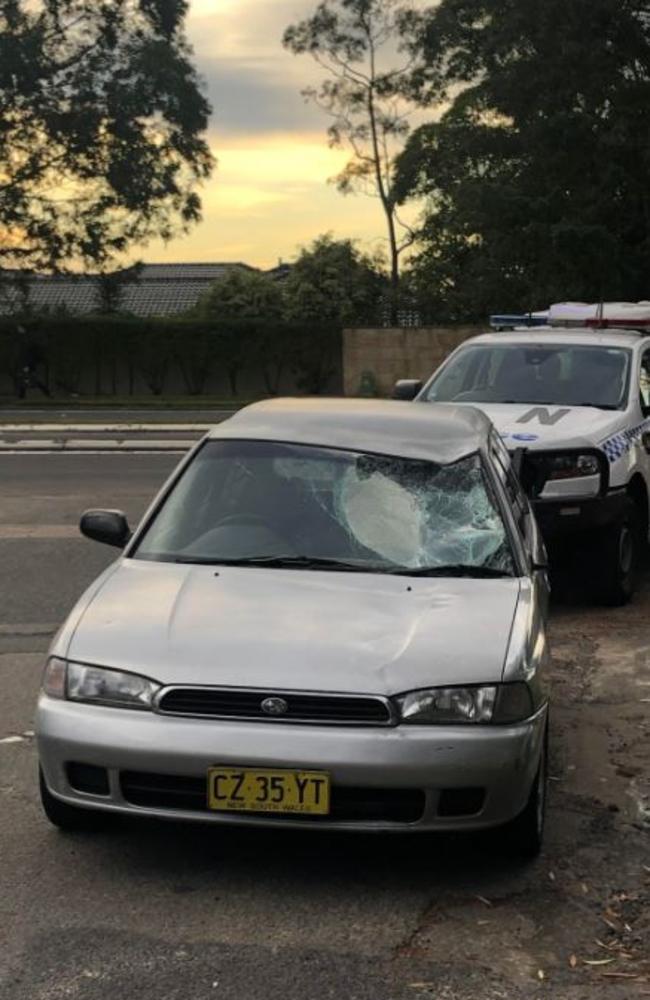 The Subaru allegedly being driven by Kyle Hakki, 22, soon after it collided with two cyclists at Belrose. Picture: Jim O’Rourke