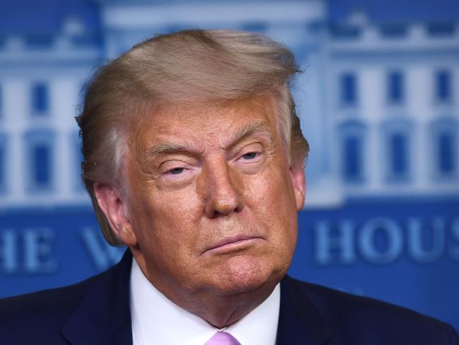 US President Donald Trump pauses as he speaks during a press briefing in the James S. Brady Press Briefing Room at the White House, in Washington, DC on August 19, 2020. (Photo by Brendan Smialowski / AFP)