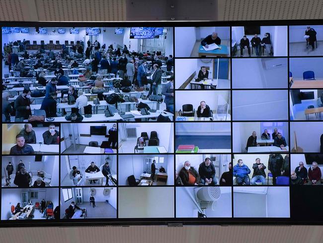 A view shows one of multiple televisions screens set up in a special courtroom. Picture: Gianluca Chinnea