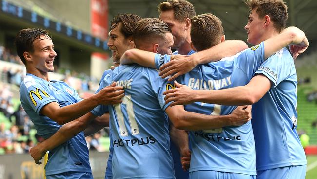 Craig Noone of Melbourne City is congratulated by teammates after scoring a goal during the round four A-League match between Melbourne City and the Wellington Phoenix at AAMI Park.