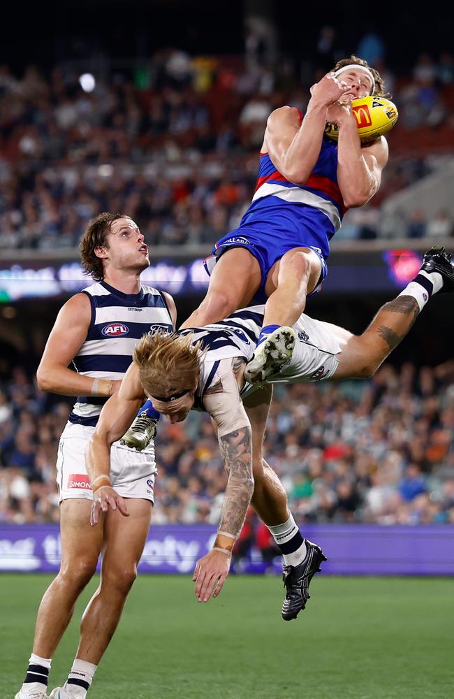 Aaron Naughton attempts a spectacular mark over Tom Stewart. Picture: Michael Willson/AFL Photos