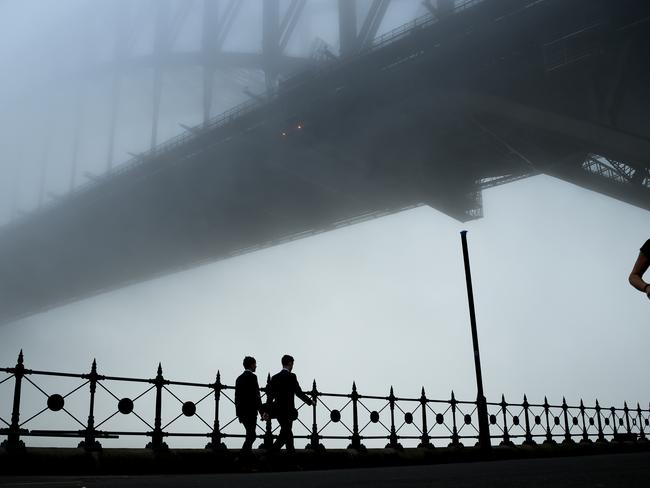 The Sydney Harbour Bridge disappears under a thick blanket of fog in Sydney, Monday, June 2, 2025. A thick fog blanketing Sydney has cancelled ferries and delayed flights. (AAP Image/Bianca De Marchi) NO ARCHIVING