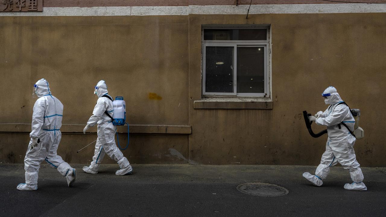 Epidemic control workers outside a Beijing residential area where people are doing home quarantine on December 8, 2022. Picture: Kevin Frayer/Getty Images