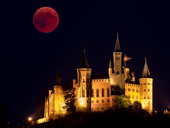 A Blood Moon rises behind The Hohenzollern Castle in Hechingen, Germany. Picture: Getty