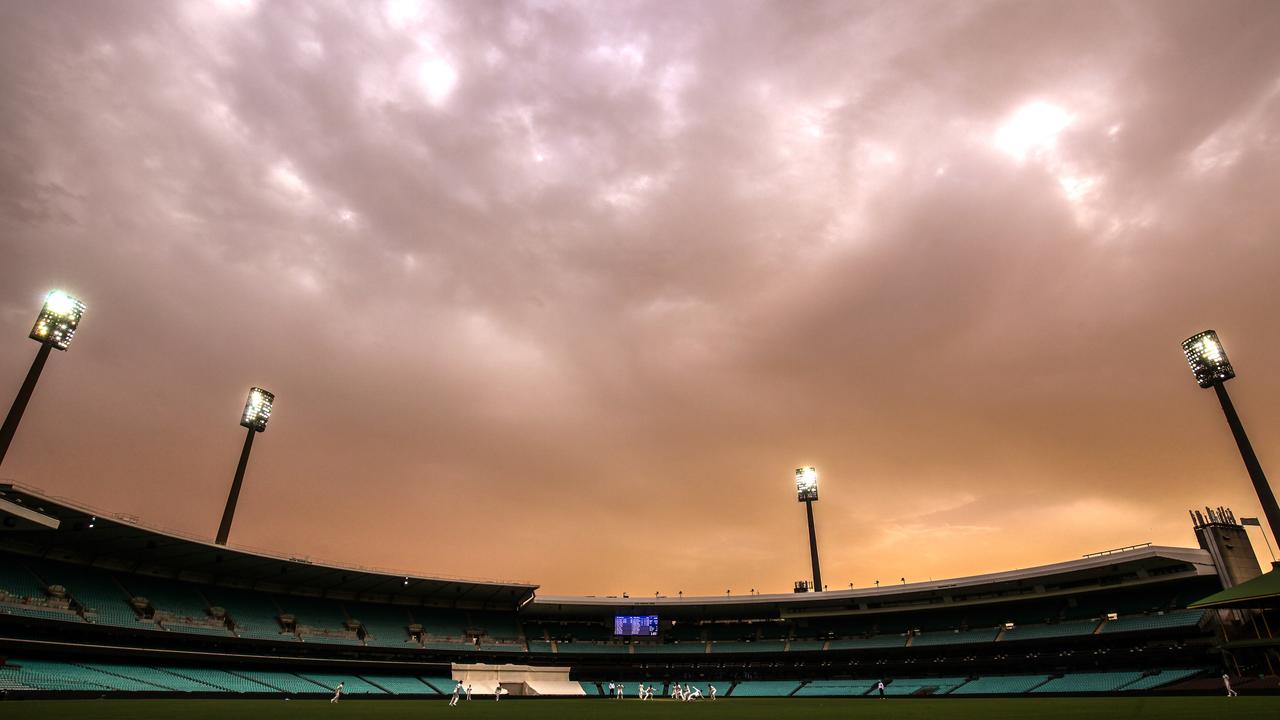 Smoke filled skies can be eerie but they can also act as a buffer between strong winds and fires. Picture: David Gray/AAP