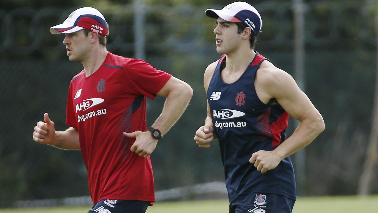 Melbourne training at Gosch's Paddock. Christian Petracca runs with Daniel Cross . Pic: Michael Klein