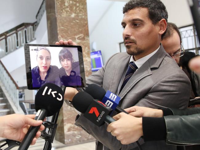 Manny Waks, CEO of Kol vÕOz, an Israel-based organisation combating child sexual abuse in the global Jewish community speaks to sisters Nicole Meyer and Dassi Erlich in front of the media. Picture: Ella Pellegrini