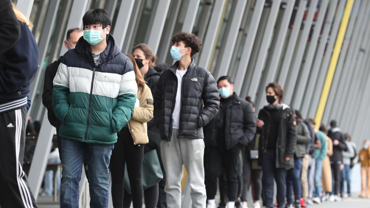 People line up for a Covid-19 vaccine at the Exhibition Building during lockdown in Melbourne. Picture: NCA NewsWire / David Crosling