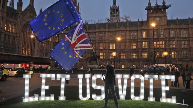 The public and civic organisation Avaaz set up a “LET US VOTE” sign outside parliament in London, on Wednesday. Picture: AP 