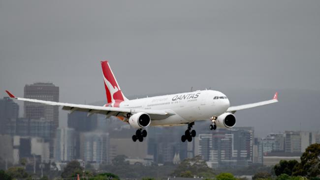 A Qantas flight lands in Adelaide. Picture: Naomi Jellicoe