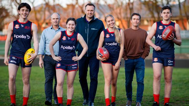 Norwood greats with their 15-year-old children who will play for the Redlegs at the SANFL Intrastate Carnival. Richard Kelly with twins Jim and Annabel, Matt Robran with daughter Aleesha and Brett James with son Archie at Norwood Oval. Picture: Matt Turner