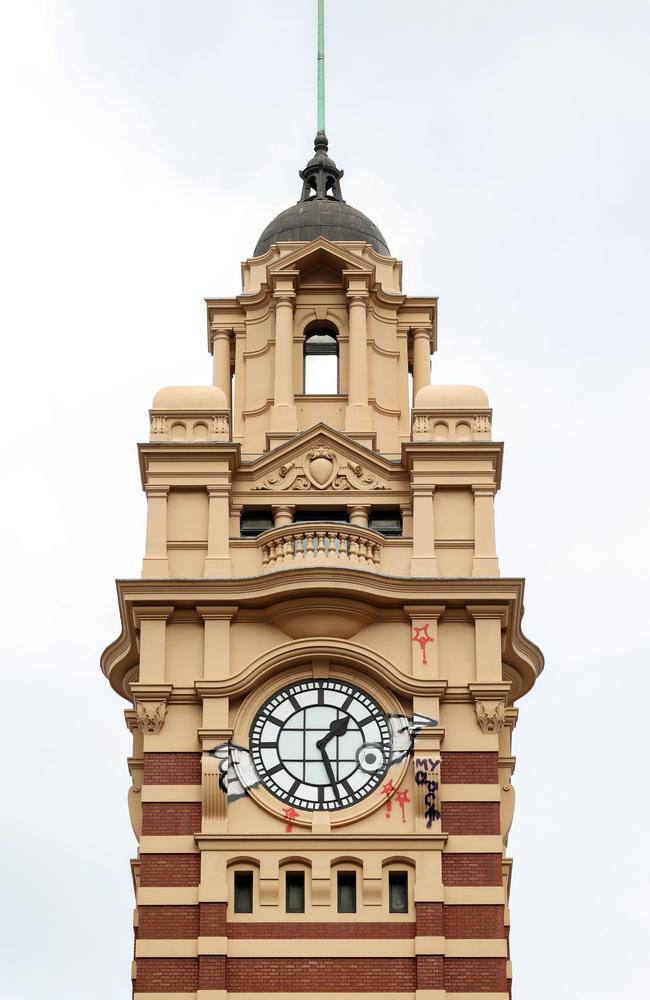 The Flinders Street Station clock tower was graffitied on July 10. Picture: Ian Currie